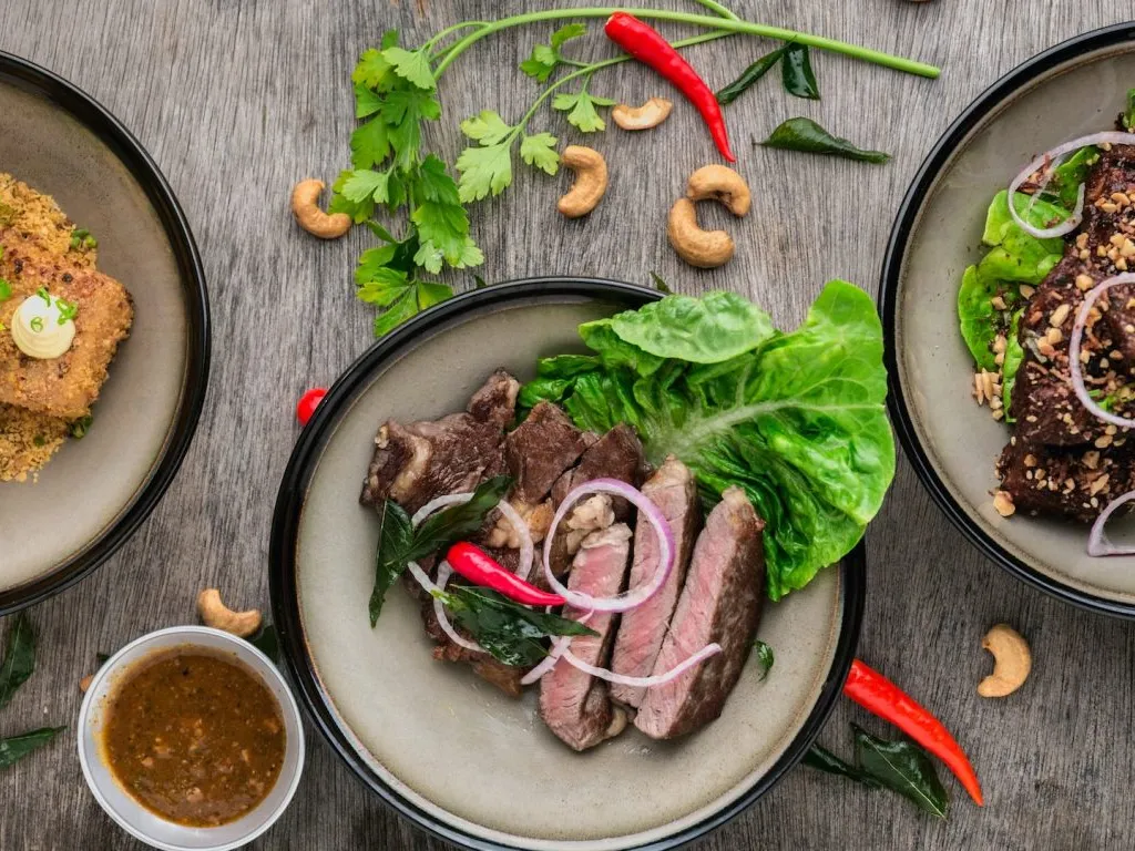 Delicious beef dish with herbs, chili, cashews and sauce